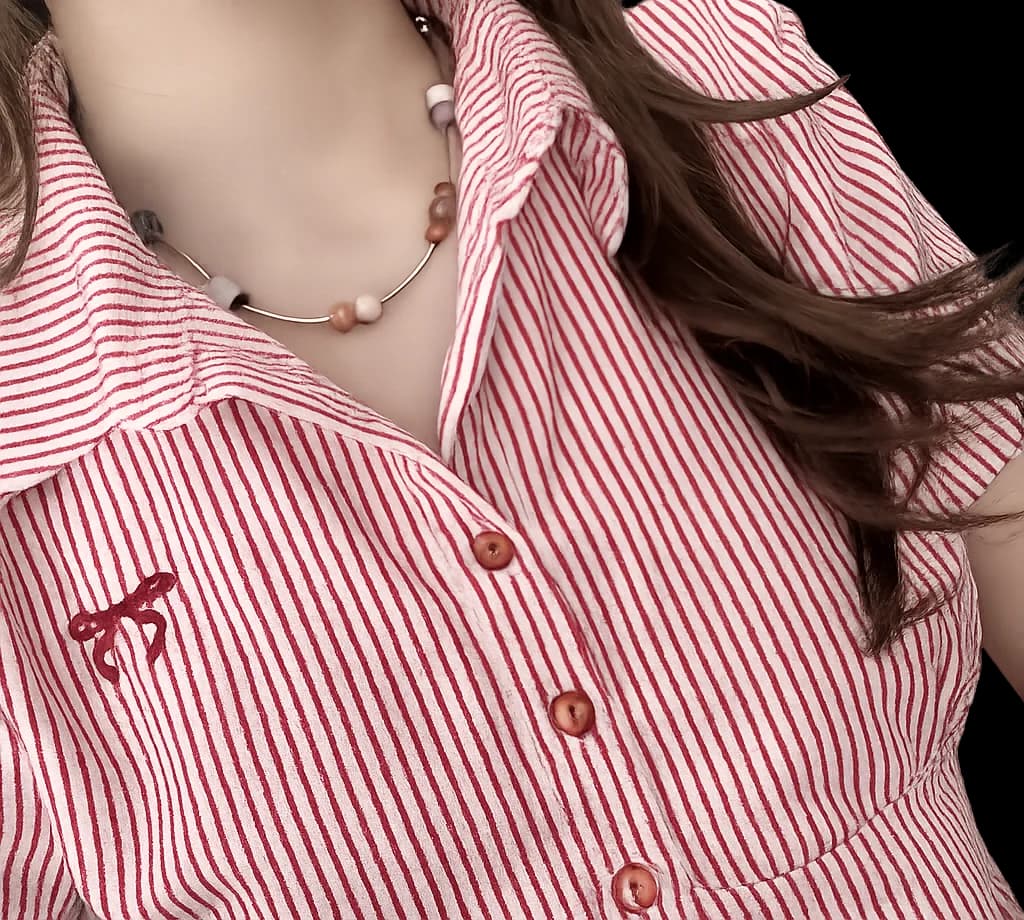 Lumoraah handmade necklace styled with a red-striped shirt